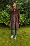 Vildmink swinger med pynteknap - Vintage