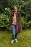Vildmink swinger med pynteknap - Vintage